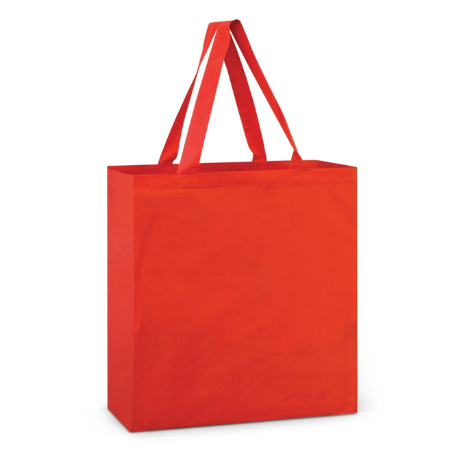A red cotton tote bag with two long handles and a square shape. It features a simple design and has a logo.