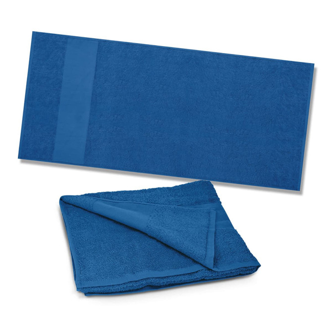 A Dune Beach Towel in a solid blue color, available in two views: one flat and one folded.