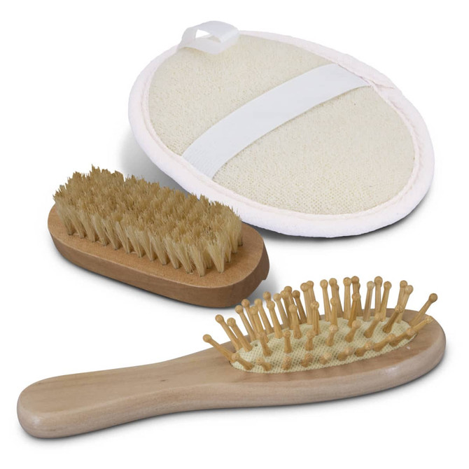 A travel set featuring a wooden hairbrush, a smaller wooden brush, and a round massage brush with a strap.
