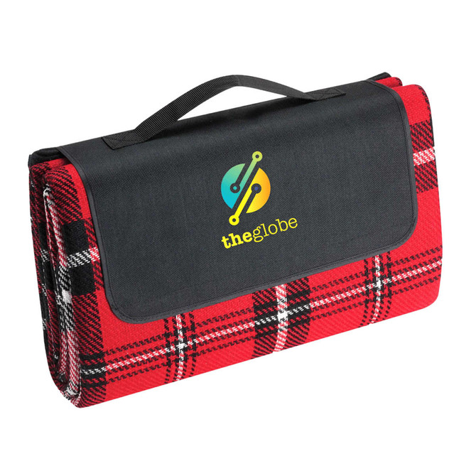 A red and black checkered picnic rug neatly folded with a black handle and a branding logo on the cover.