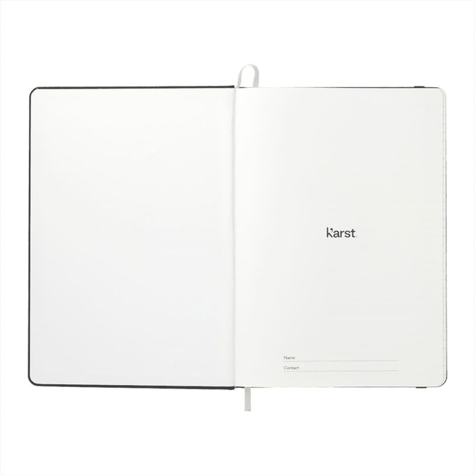 An open A5 hardcover notebook with a plain white interior and a logo on the first page. Features a black cover.