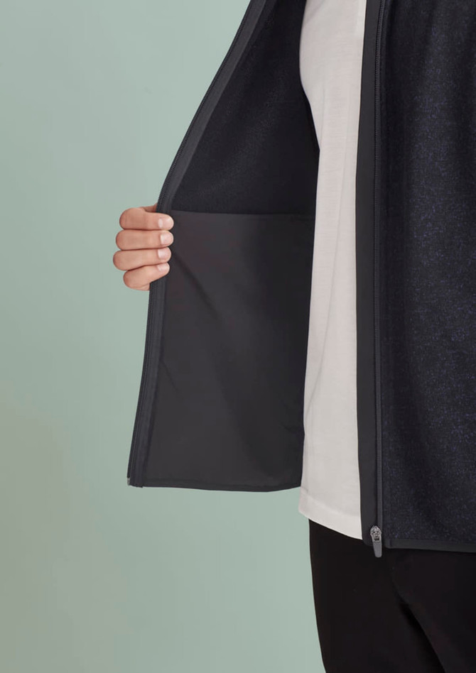 A men's zip front vest in dark fabric, featuring a hidden pocket inside the open front.