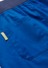 A close-up of blue women's jogger scrub pants featuring a back pocket and waistband. Includes a logo tag.