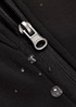 A close-up of a black soft shell jacket featuring a zipper and droplets of water on the fabric.