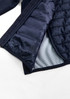 A unisex patrol jacket in navy blue, featuring a quilted lining and an interior texture pattern. It includes a logo.