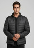 A puffer jacket in black, featuring a zip-up front and a modern, fitted design, with a logo on the chest.