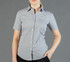 A button-up shirt in a light grey with short sleeves, featuring a subtle striped pattern and a logo.