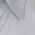 A light grey button-up shirt featuring a classic collar and smooth fabric texture. Branding visible on the shirt.
