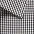 A close-up of a button-up shirt featuring a black and white gingham pattern with a folded collar.