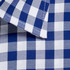 A close-up of a blue and white check patterned button-up shirt with a folded collar.