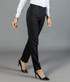 Black slim leg slacks featured on a model, paired with a white shirt and high heels. The background is grey.