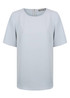A light blue short sleeve shirt with a round neckline and a zip back. It features a subtle logo on the fabric.