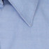 A light blue button-up shirt featuring a classic collar and a minor branding element.