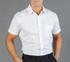 A button-up shirt in white, featuring a pocket and a collared neckline, displayed on a model.