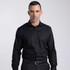 A black button-up shirt on a male model, featuring a collar and a button-down front. The shirt has a logo on it.