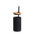 A drink bottle featuring a clear glass body, a black silicone sleeve, a bamboo lid, and a black straw. A drink bottle featuring a clear glass body, a black silicone sleeve, a bamboo lid, and a black straw.