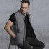 A grey puffa vest with a high collar, featuring side pockets and a buttoned front.