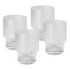 A set of four clear ribbed glass tumblers with a textured design and short bases.