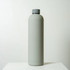 A drink bottle in a sleek, light grey finish, featuring a grey screw-top lid and a minimalist design.