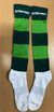 Green and dark green striped football socks with white foot sections and a logo on the cuff.