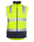 High-visibility softshell vest in bright yellow with reflective silver stripes and a navy blue base. Features a zipper and logo. High-visibility softshell vest in bright yellow with reflective silver stripes and a navy blue base. Features a zipper and logo.