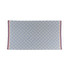 A blue and white patterned beach towel with fringed edges and a red stripe. Features a logo in one corner.