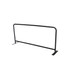 A black crowd control barrier with a tubular metal frame and flat feet for stability, featuring a branding logo.
