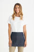 A woman in a white t-shirt wears a dark denim short waist apron. The apron features stitching details and a logo.