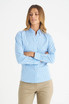 A blue checked long sleeve button-up shirt for ladies, featuring a collar and fitted design. It has a logo.