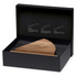 A wedge-shaped wooden cheese knife block set in a black box, featuring a textured interior and a branding logo.