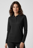 A black long sleeve polo shirt for women featuring a collar and button placket, with a logo on the left side.