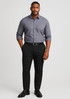 A man wearing a grey shirt and black modern stretch chino pants, paired with black shoes and a belt.