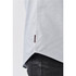 A light grey button-up shirt with a side hem detail and a small brand logo.