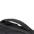 A close-up of a black backpack featuring a sturdy handle and textured fabric. It has a logo visible on it.