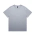 A light grey t-shirt with a relaxed fit and a label inside. The shirt features short sleeves and has a simple design.
