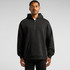 A relaxed half zip hoodie in black, featuring a front pocket and a hood, showcased on a model.