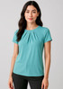 A teal short sleeve top with pleats, featuring a fitted design and a subtle logo.