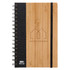 A spiral-bound A5 notebook with a bamboo cover, black fabric side, and an elastic band. It features a logo on the front.