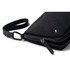 A black toiletry bag with a zippered closure and a detachable strap, featuring a discreet logo.