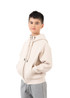 A light beige hoodie with a kangaroo pocket and zipper, featuring a logo. The model wears grey pants.