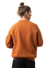 A brown sweatshirt with a relaxed fit, featuring raglan sleeves and a plain design without visible logos.