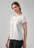 A short sleeve blouse in light grey, featuring a rounded neckline and a casual fit, displayed on a model. A short sleeve blouse in light grey, featuring a rounded neckline and a casual fit, displayed on a model.
