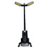 A portable torch with a tall, adjustable stand, featuring two yellow LED panels and a black body.