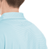 A light blue men's polo shirt with a striped pattern and a small logo on the back collar.