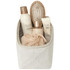 A beige toiletry organiser containing hair products, a hairbrush, and a shower loofah. It has a simple design and a logo.