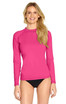 A long sleeve rashie in bright pink, featuring a fitted design and a logo on the sleeve.