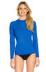 A long sleeve blue rashie with a fitted design, featuring a logo. Suitable for outdoor activities.
