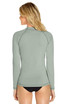 A long sleeve rashie in a muted green colour, featuring a logo on the back.