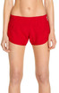 A pair of red swim shorts with an elastic waistband, designed for women, featuring a logo.
