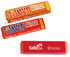 Three wrapped chocolate bars in vibrant orange and red packaging, featuring a logo on each wrapper.